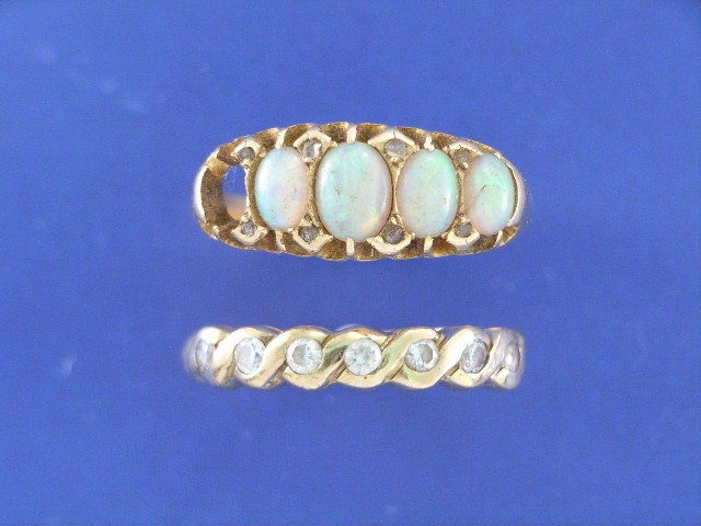 Appraisal: A ct gold five opal and diamond set dress ring