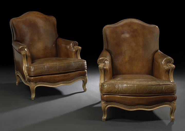 Appraisal: Pair of Louis XV-Style Fruitwood and Leather-Upholstered Bergeres early th