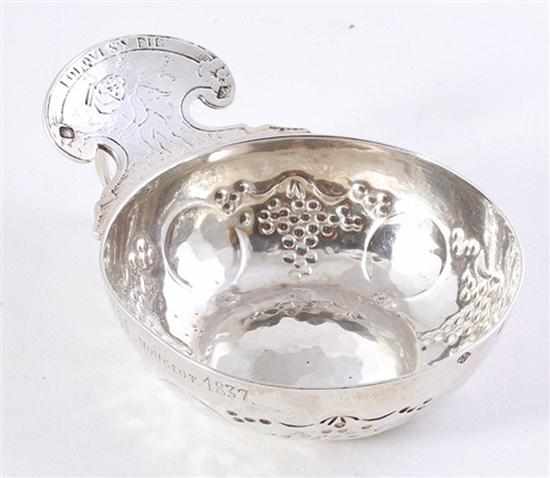 Appraisal: French silver wine taster dated shaped handle with cherub design