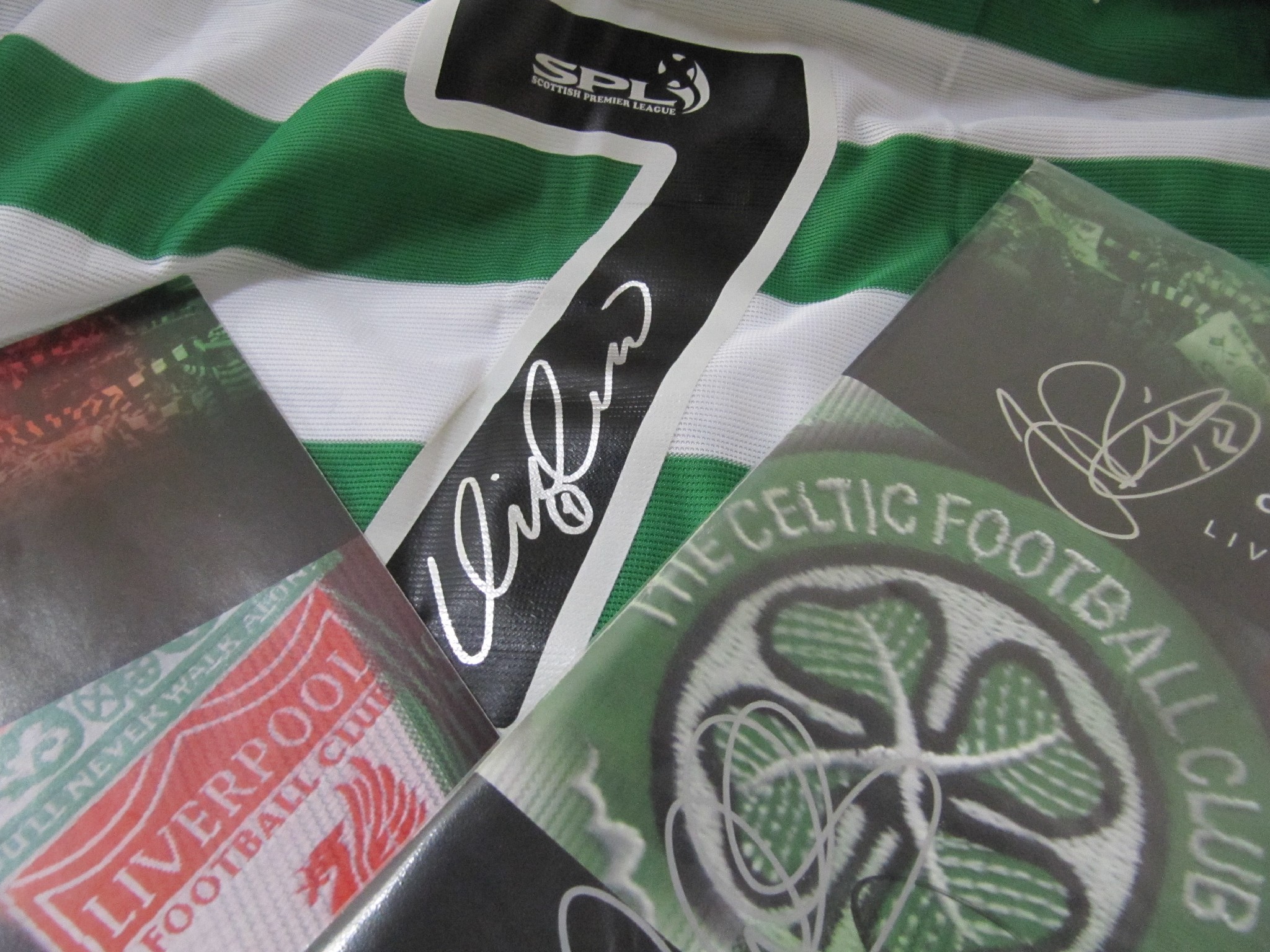 Appraisal: A replica Celtic shirt signed by Henrik Larsson and a