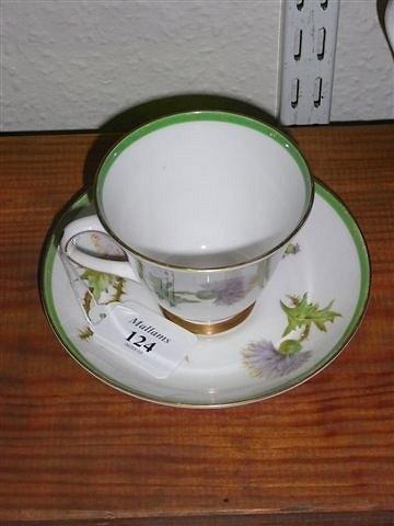 Appraisal: A ROYAL DOULTON 'GLAMIS THISTLE' CUP AND SAUCER painted by