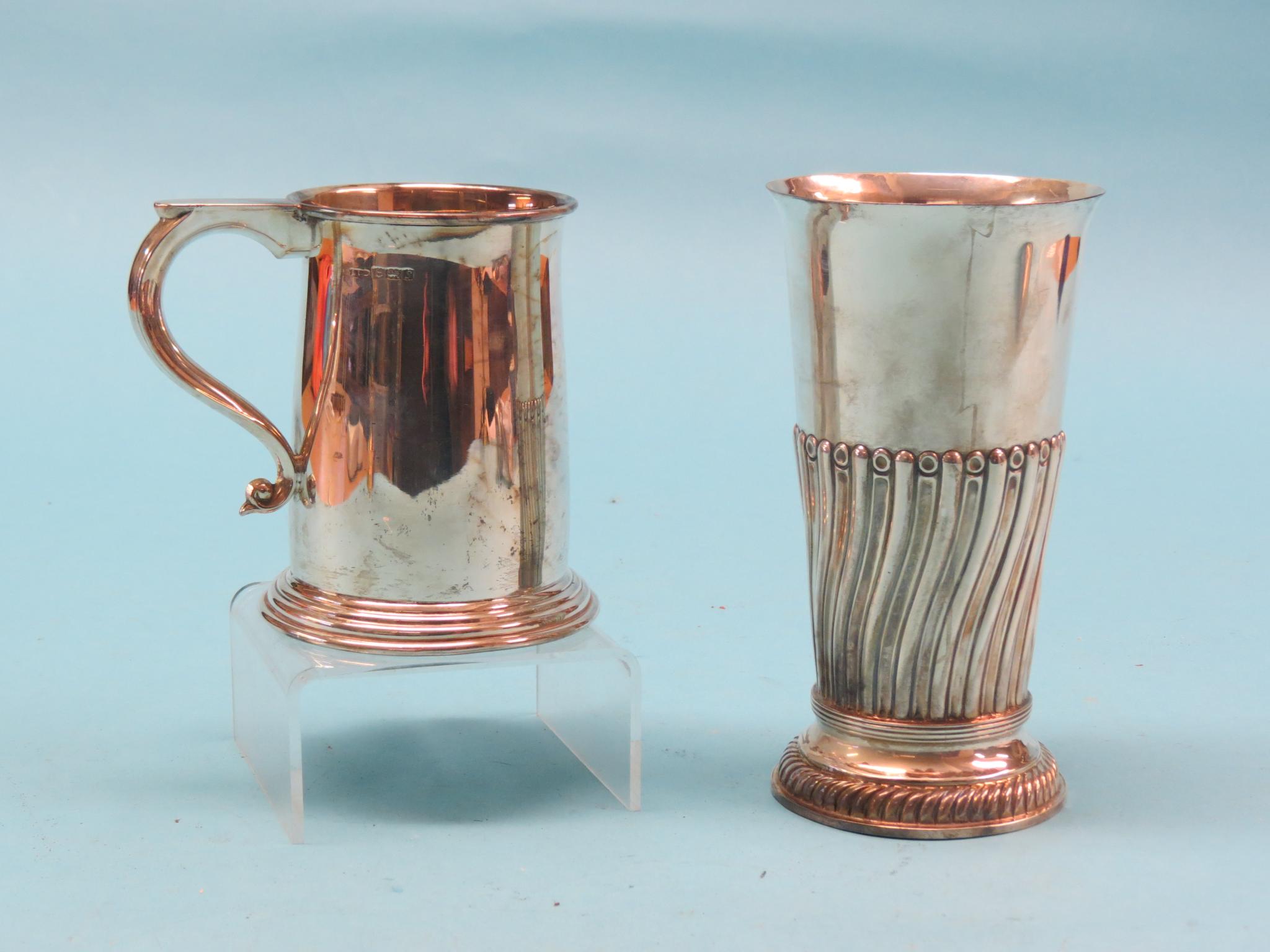 Appraisal: A large silver beaker tapering-shape with wrythen ornament Sheffield duty