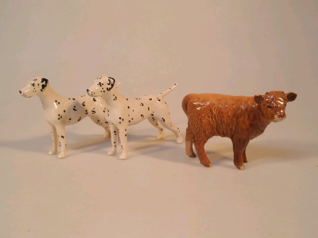 Appraisal: Two Beswick Dalmations and a Beswick Aberdeen Angus calf and