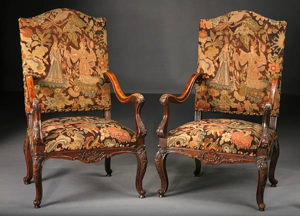 Appraisal: A pair of R gence style walnut and needlework upholstered