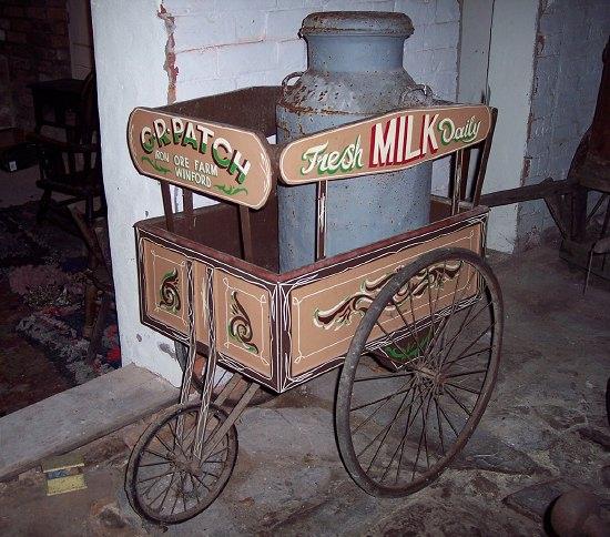 Appraisal: A three-wheeled milk cart the front plate painted 'G R