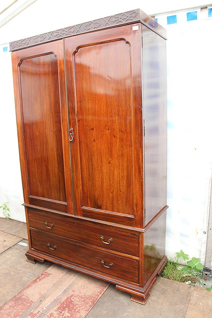 Appraisal: AN EARLY TH CENTURY MAHOGANY WARDROBE IN A GEORGE III