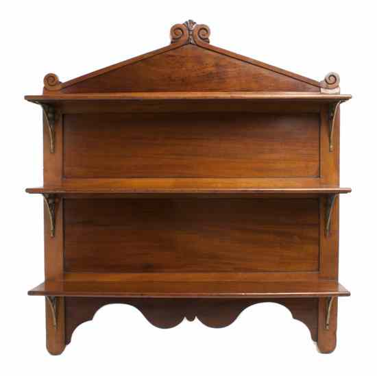 Appraisal: An American Mahogany Hanging Shelf having a carved fleur-de-lis crest