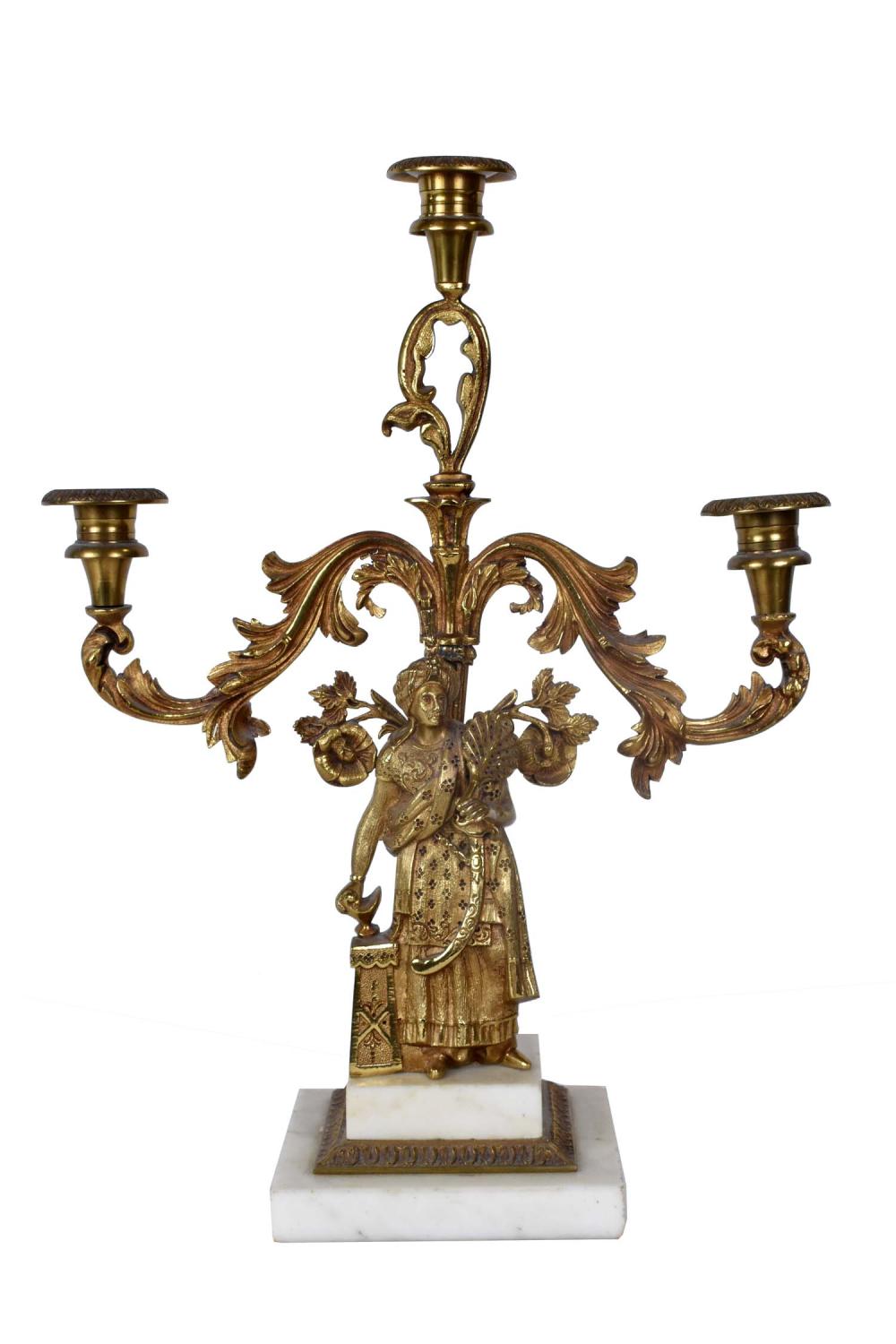 Appraisal: The leaf cast arm supporting three candle nozzles above the