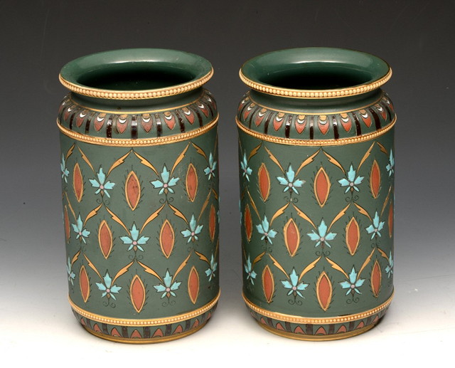 Appraisal: A PAIR OF METTLACH VASES with stylised geometric polychrome decoration