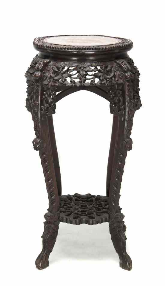 Appraisal: A Chinese Carved Hardwood Stand the frame heavily carved with