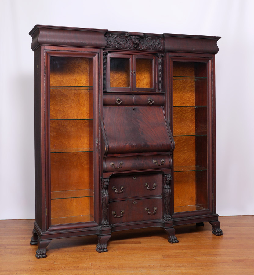 Appraisal: VICTORIAN MAHOGANY TRIPLE SECTION BOOKCASE Shaped pediment with carved foliate