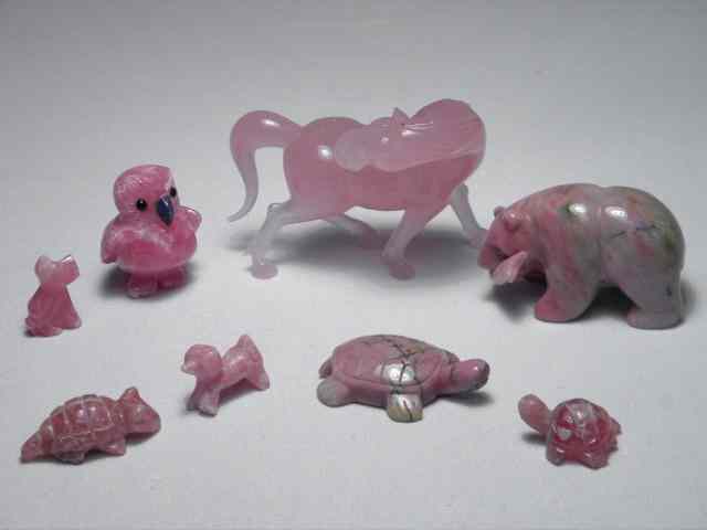 Appraisal: Eight rose colored carved stone animals Includes pink and grey