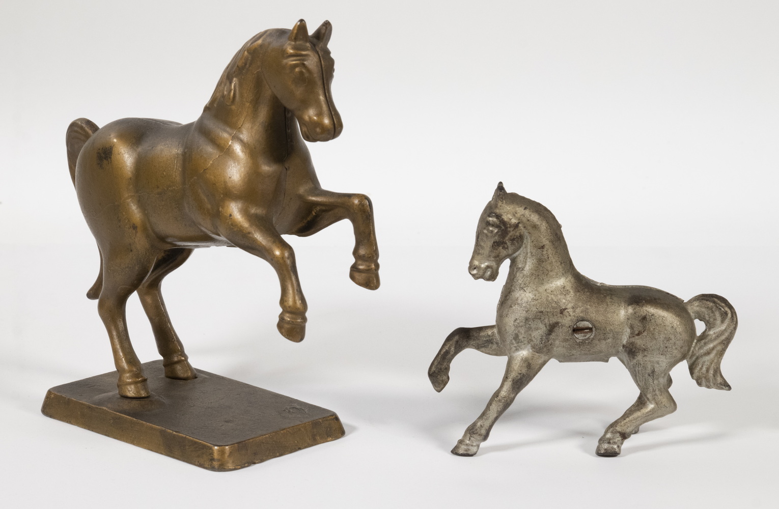 Appraisal: PRANCING HORSE IRON STILL BANKS Including Large prancing horse on