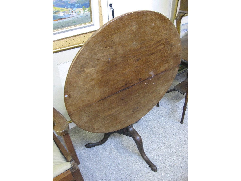 Appraisal: Mahogany circular tilt top occasional table upon triform base