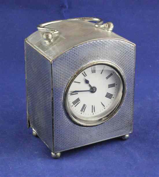 Appraisal: An Edwardian engine turned silver cased carriage timepiece with domed