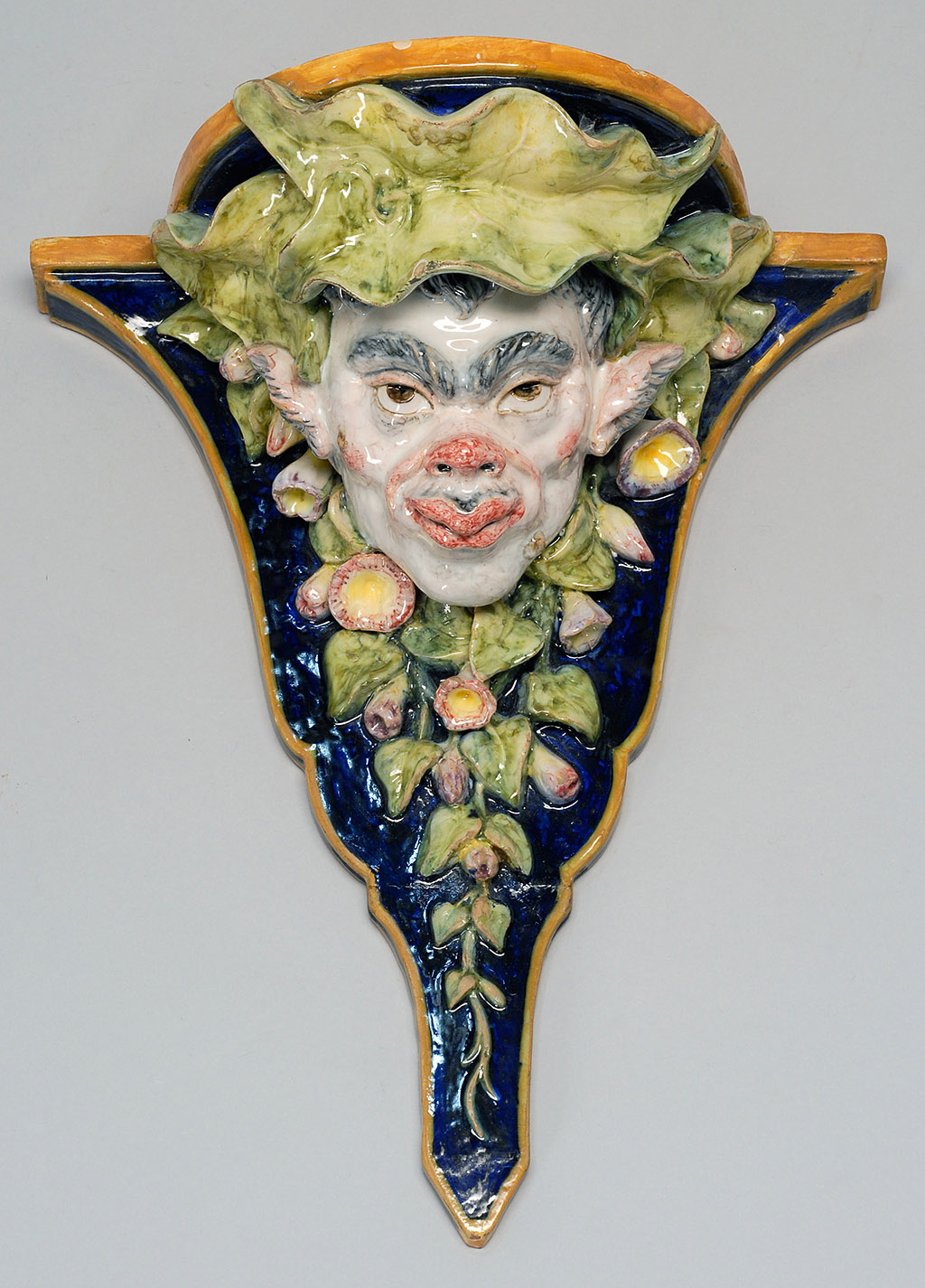 Appraisal: GINORI POTTERY BRACKET SHELF Early th CenturyWith high-relief mask design