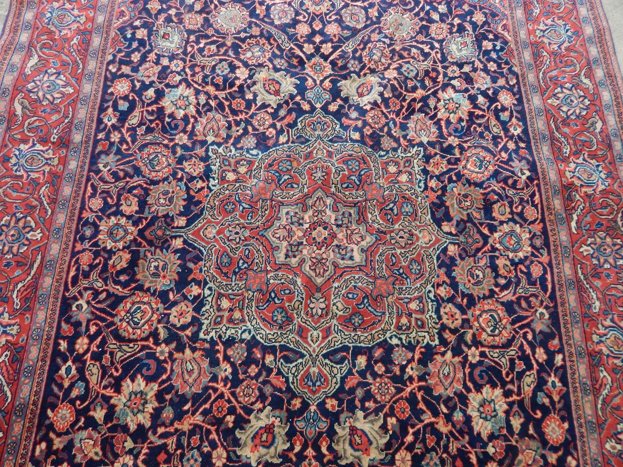 Appraisal: A Persian type carpet with a design of flowers leaves