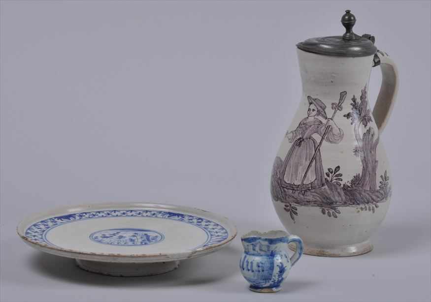 Appraisal: THREE CONTINENTAL FAIENCE WARES Comprising a baluster-shaped jug with pewter