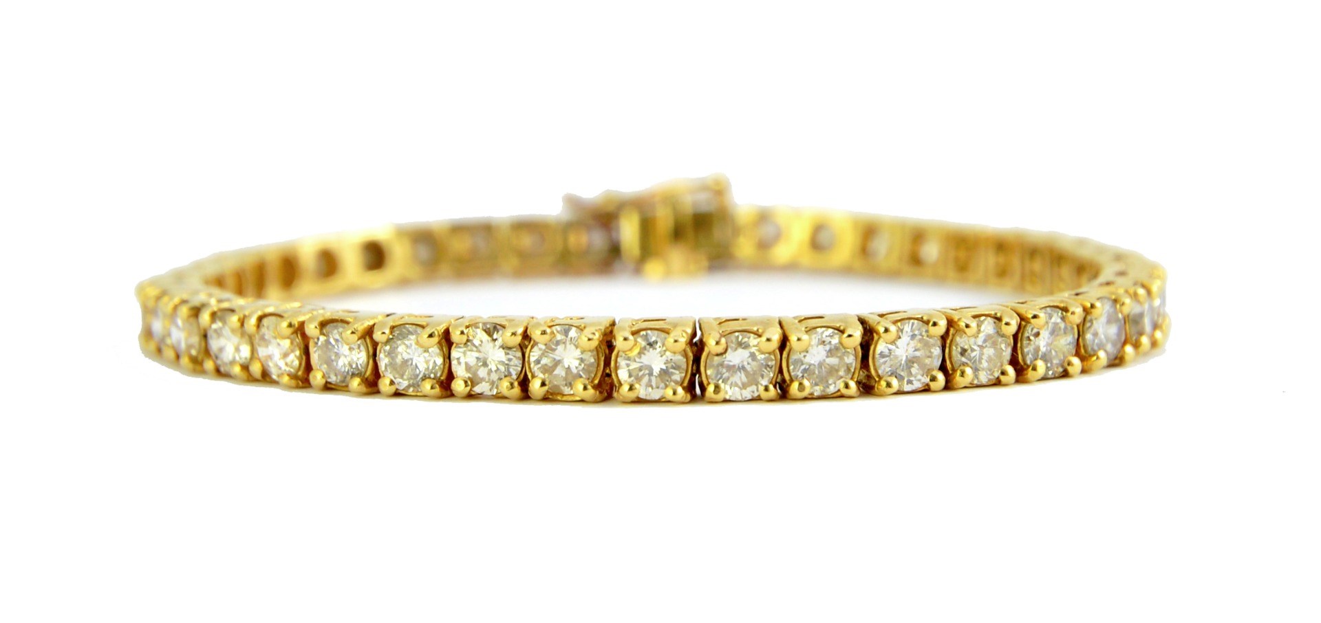 Appraisal: A gold and diamond set line bracelet claw set with