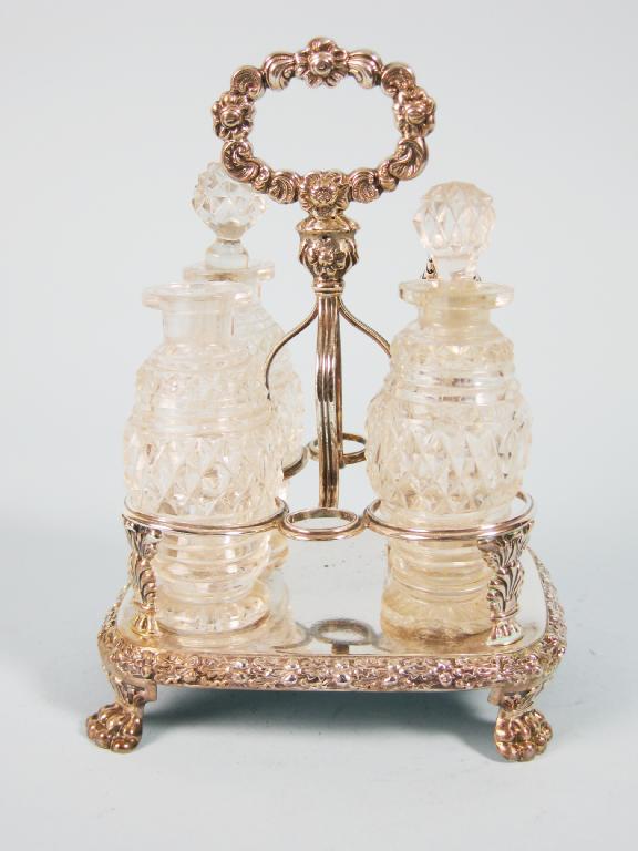 Appraisal: A George III four bottle Cruet with central handle on