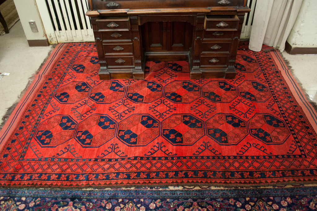 Appraisal: HAND KNOTTED ORIENTAL CARPET Afghan Ersari featuring three columns of