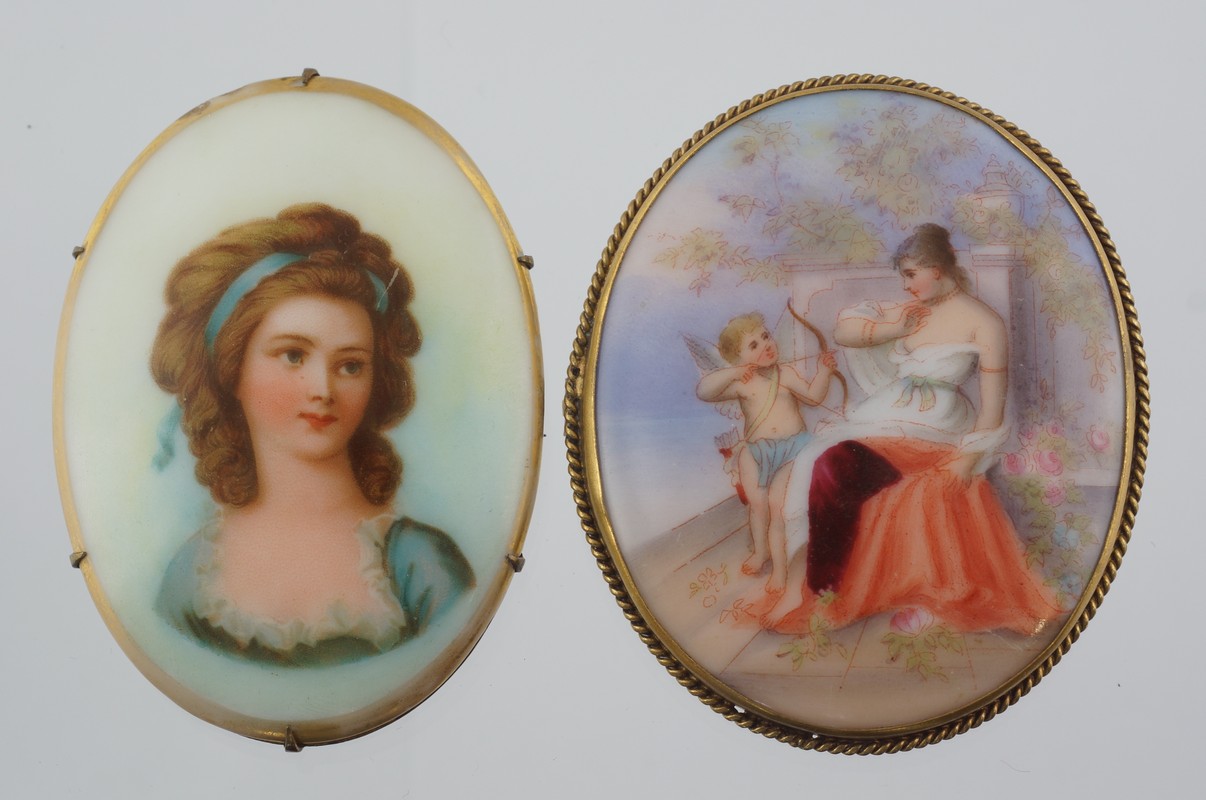 Appraisal: oval HP porcelain pins woman w cherub bust portrait largest