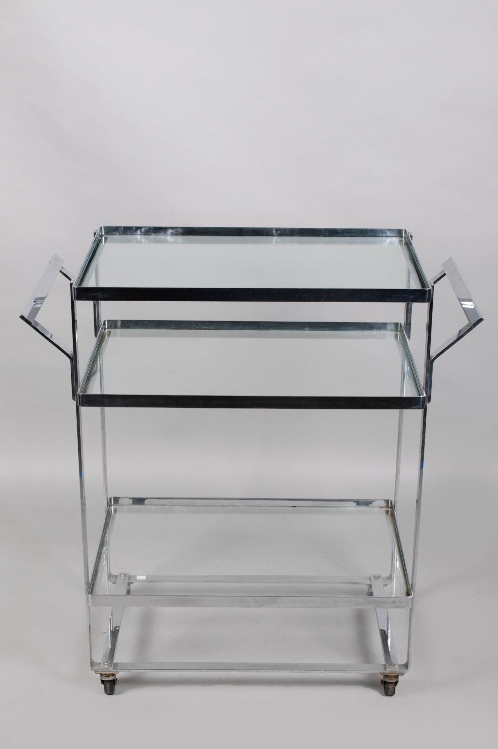 Appraisal: CHROME BAR CART s the three-tier rounded rectangular trolley with