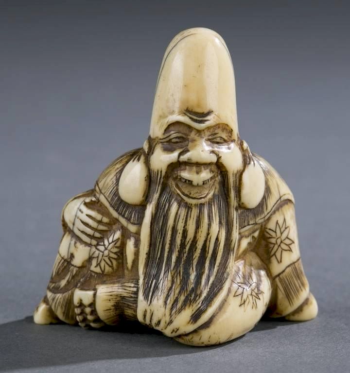 Appraisal: Group of three Japanese ivory netsuke th A group of