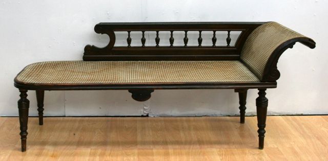 Appraisal: A late Victorian stained beech and caned collapsible chaise longue