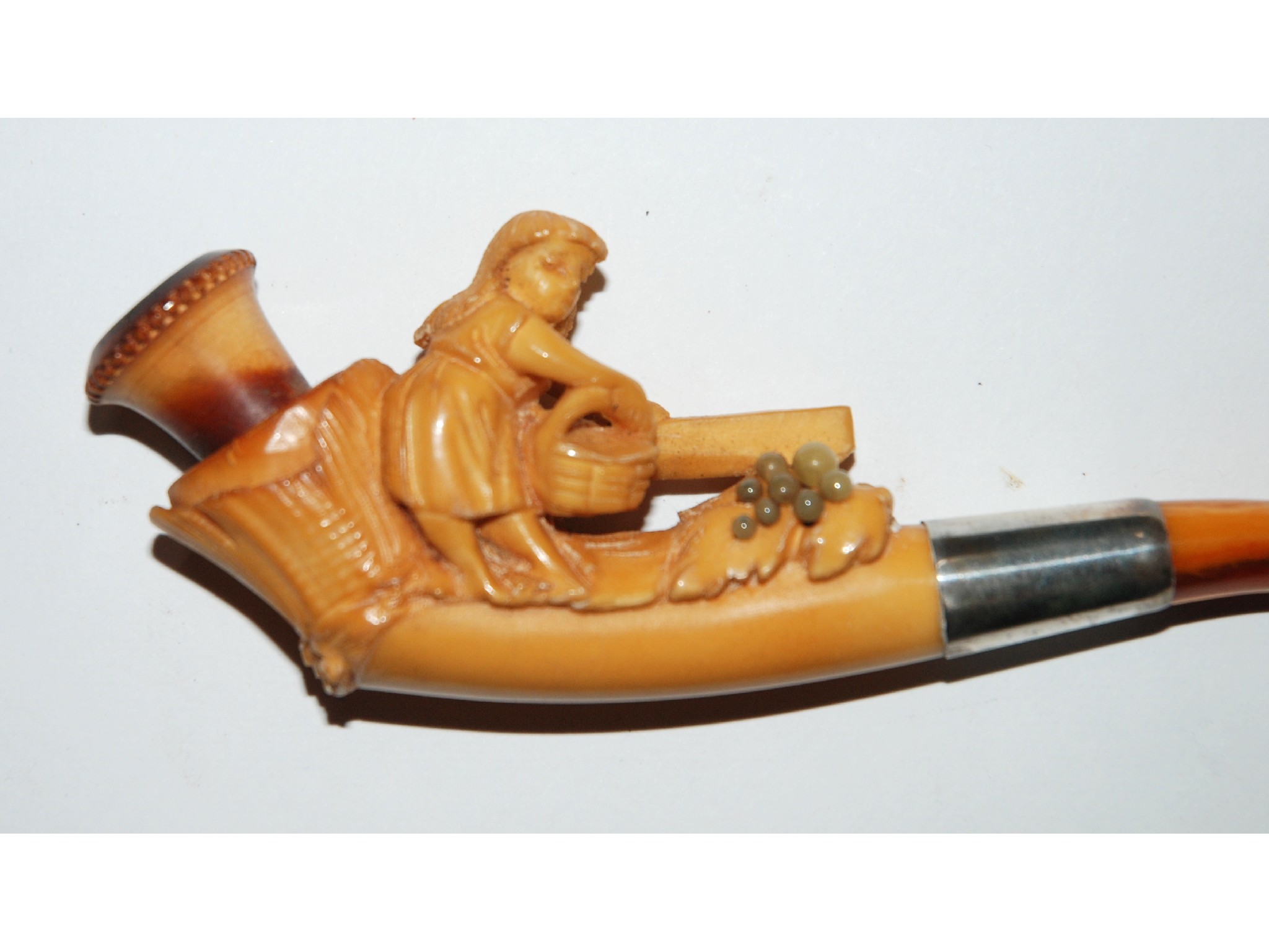 Appraisal: A carved pipe modelled with a figure of a woman