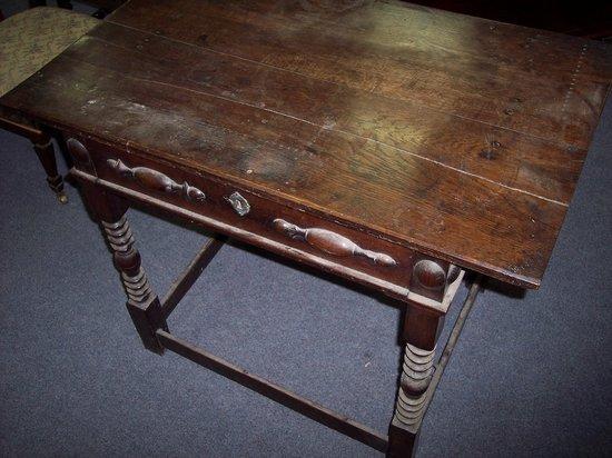 Appraisal: An oak side table fitted a single drawer on turned