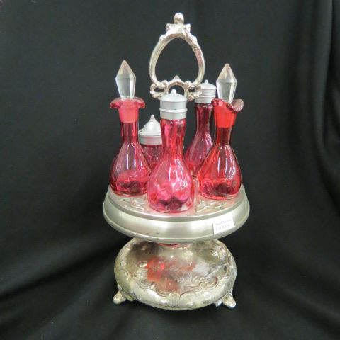 Appraisal: Cranberry Art Glass Castor Set silver plate rotating base plate