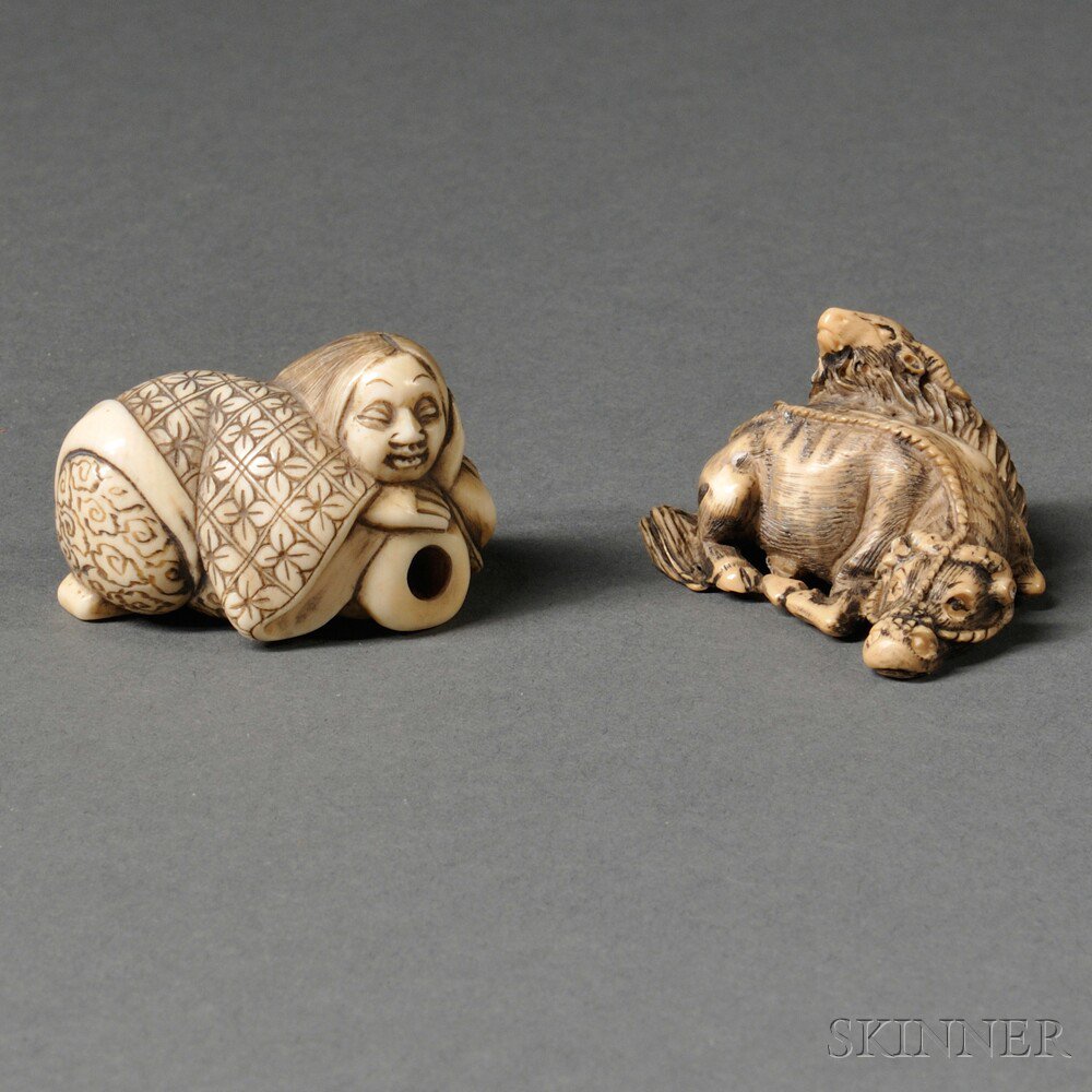 Appraisal: Two Ivory Netsukes Japan th century a reclining female and