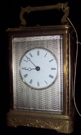 Appraisal: A French carriage clock with repeat mechanism and engine turned