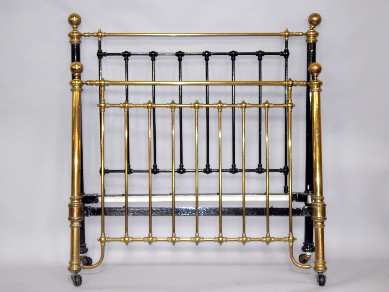 Appraisal: A Victorian brass and cast iron double bed with stretchers