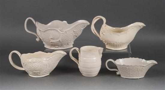 Appraisal: Two Staffordshire creamware sauceboats similar cream jug and two white