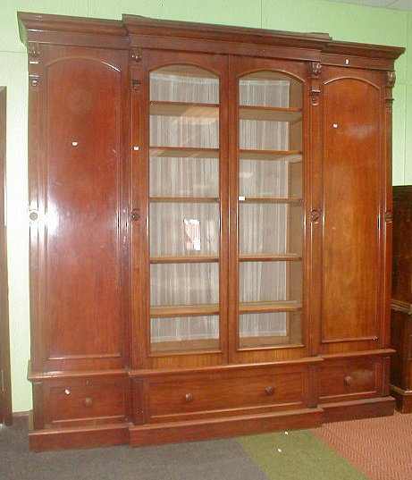 Appraisal: A Victorian mahogany four door break front cabinet with moulded