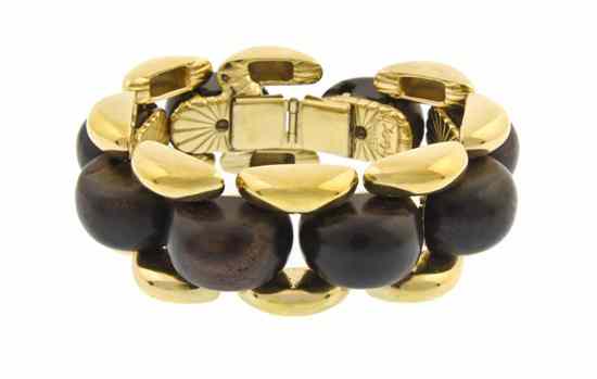 Appraisal: An Yves Saint Laurent Wood and Goldtone Bracelet Stamped YSL