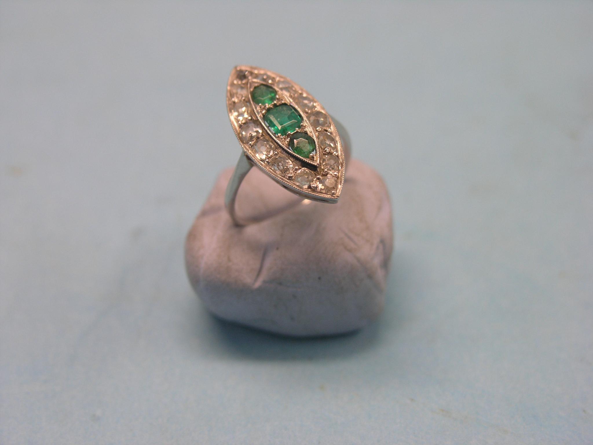 Appraisal: An Art Deco emerald and diamond marquise ring three emeralds