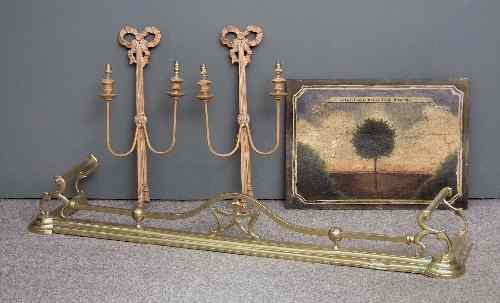 Appraisal: A late Victorian brass rail fender of shaped outline ins