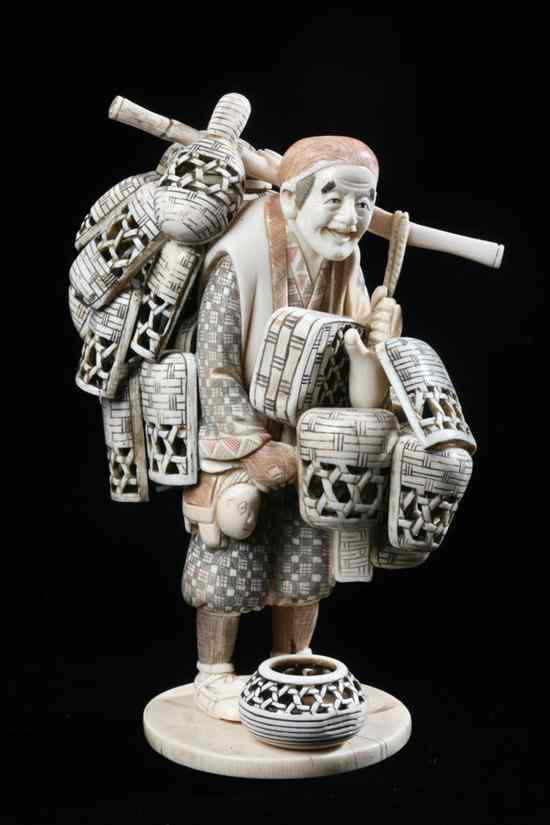 Appraisal: JAPANESE IVORY OKIMONO OF BASKET SELLER - in high