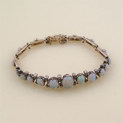 Appraisal: An opal and diamond bracelet Mounted with graduated oval shaped