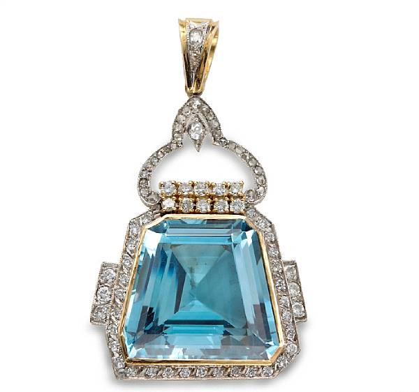 Appraisal: A blue topaz and diamond pendant centering a trapezoid-shaped blue