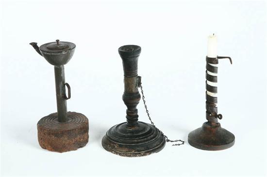 Appraisal: THREE LIGHTING DEVICES Nineteenth century Includes a tin fat lamp