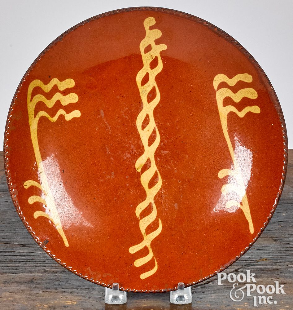 Appraisal: Pennsylvania redware plate th c Pennsylvania redware plate th c