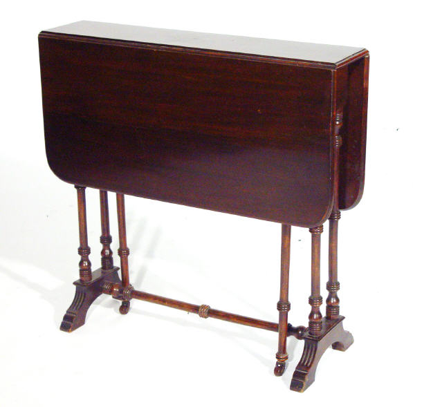 Appraisal: Edwardian rectangular mahogany Sutherland table on turned supports and stretcher