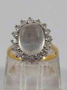 Appraisal: A hallmarked ct gold moonstone and diamond ring the cabochon