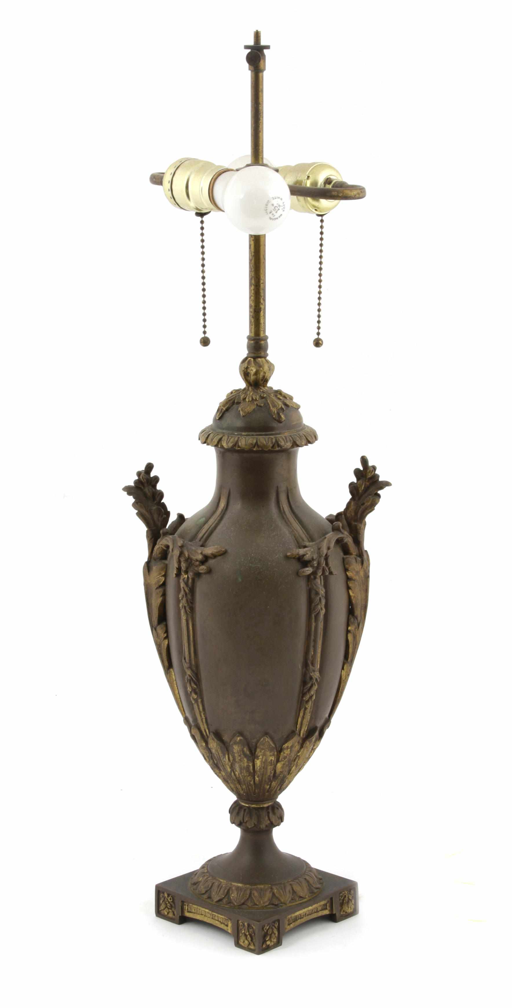 Appraisal: A French gilt and patinated bronze table lamp height in