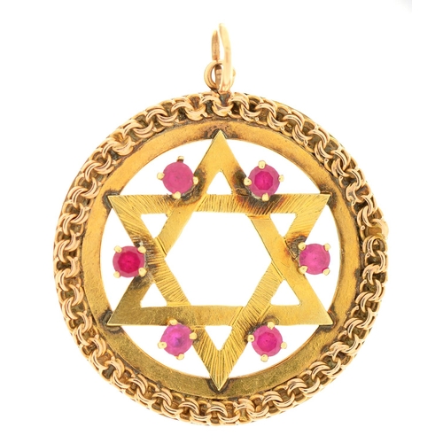 Appraisal: An Israeli synthetic ruby and gold openwork Star of David