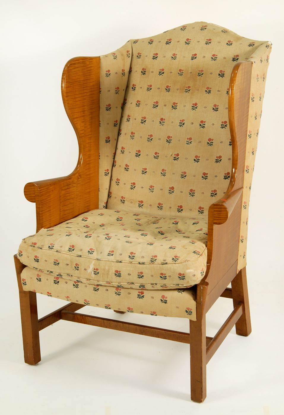 Appraisal: CHIPPENDALE-STYLE WING CHAIR Early th CenturyWith tiger maple wings and